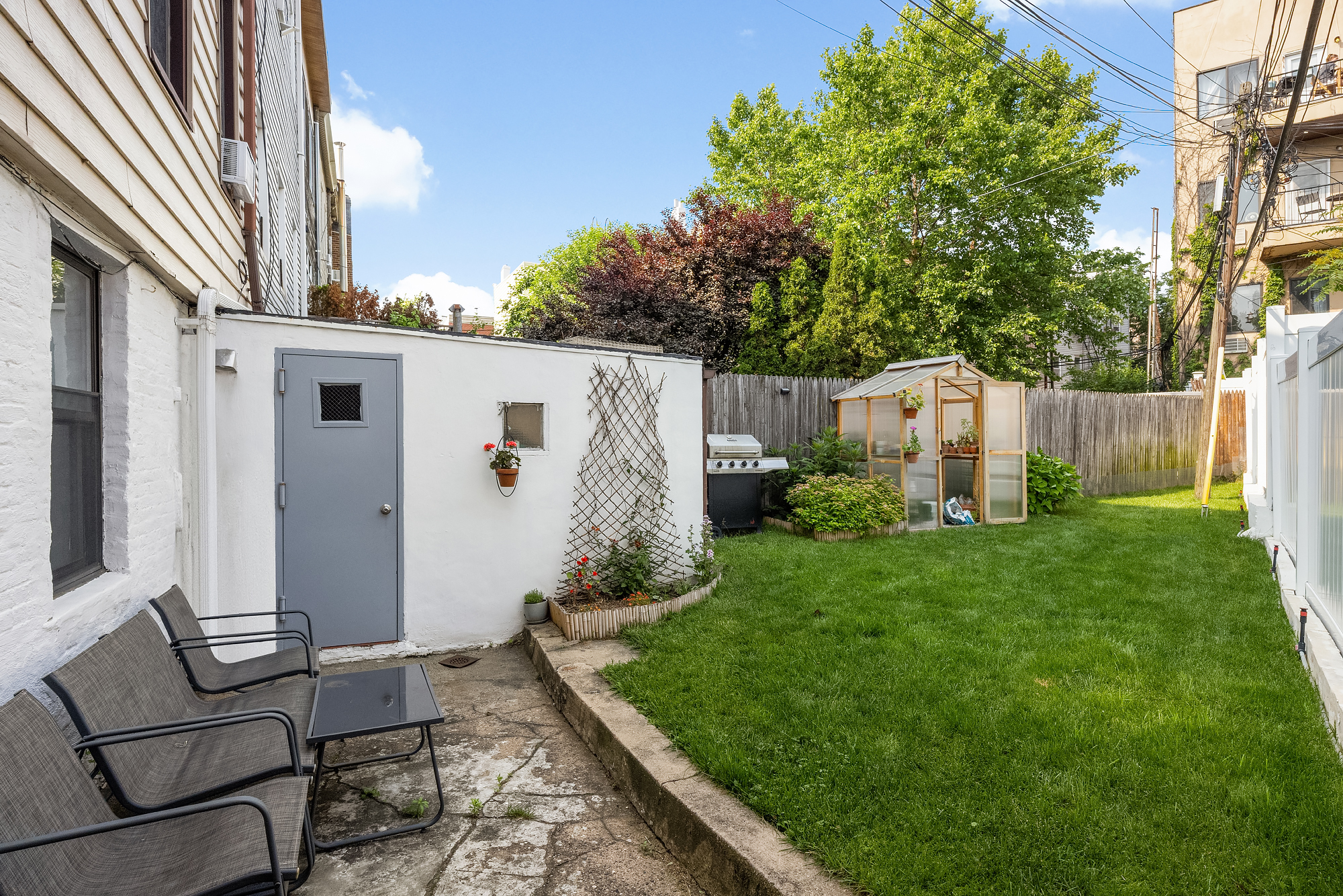 18 Russell Street Brooklyn, NY 11222 - Photo 9 of 24 a backyard of a house with table and chairs