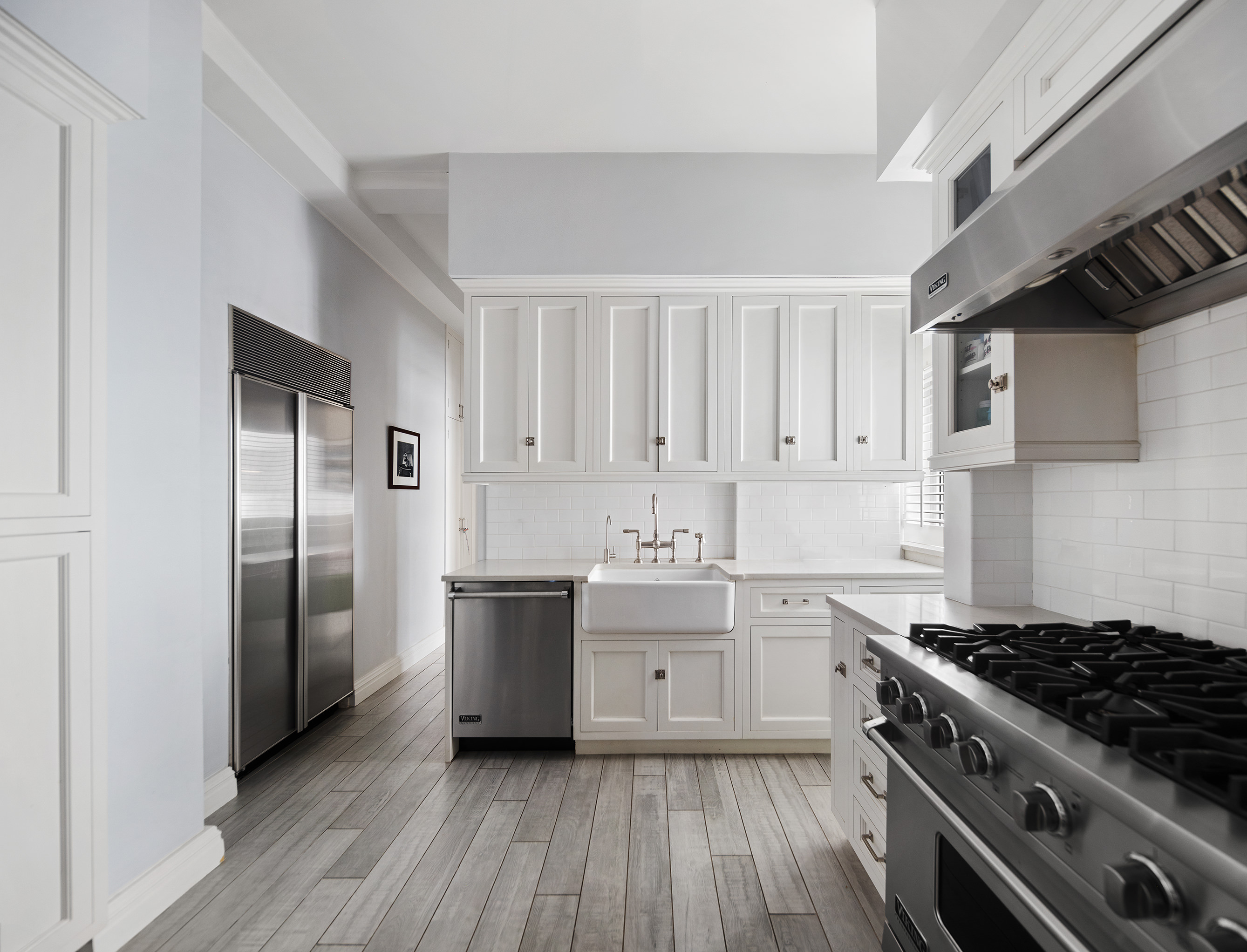 570 Park Avenue, Unit 10D Manhattan, NY 10065 - Photo 9 of 17 a kitchen with a stove sink and refrigerator