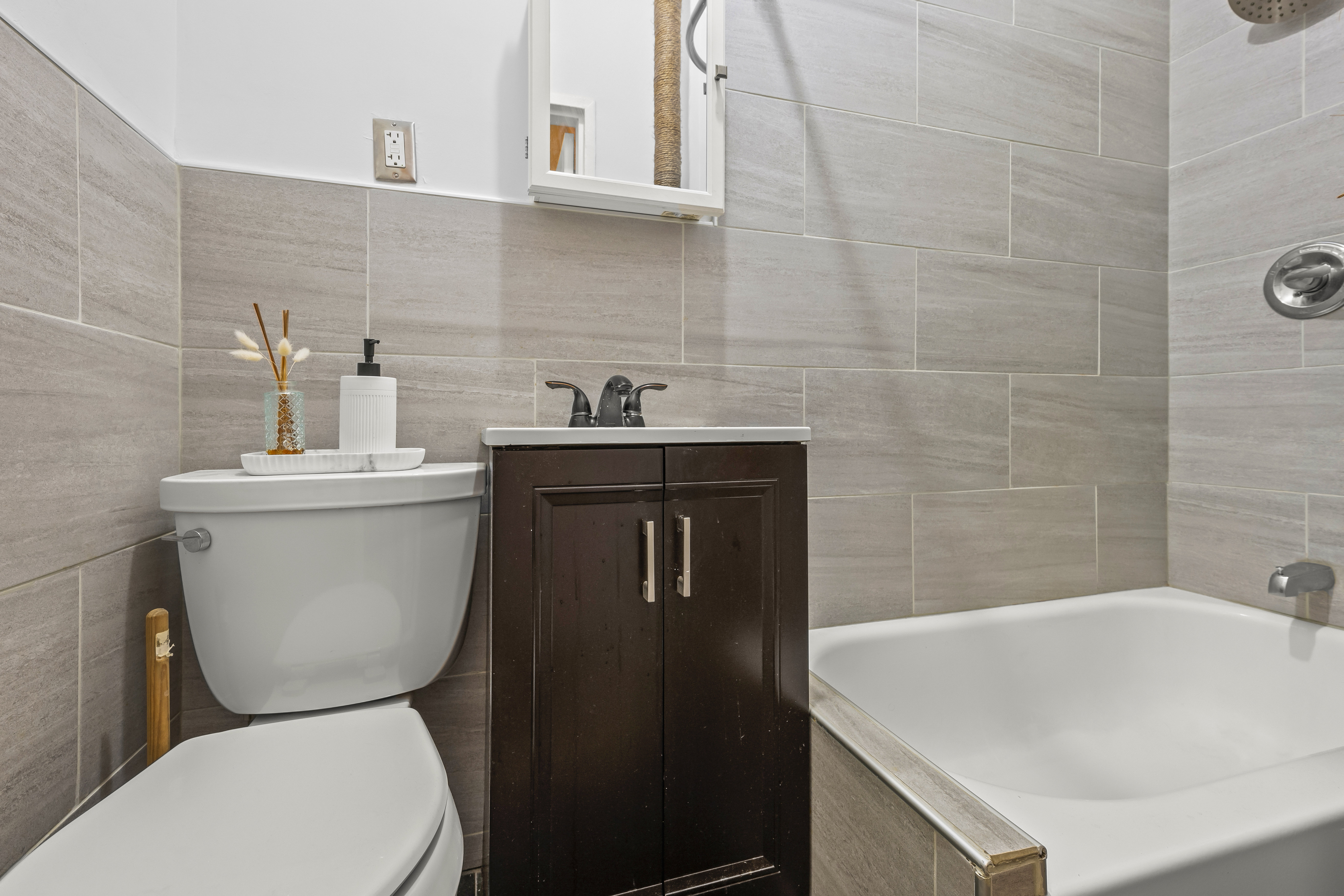 1777 Madison Avenue, Unit 24 Manhattan, NY 10035 - Photo 10 of 20 a bathroom with a sink a toilet and a bathtub