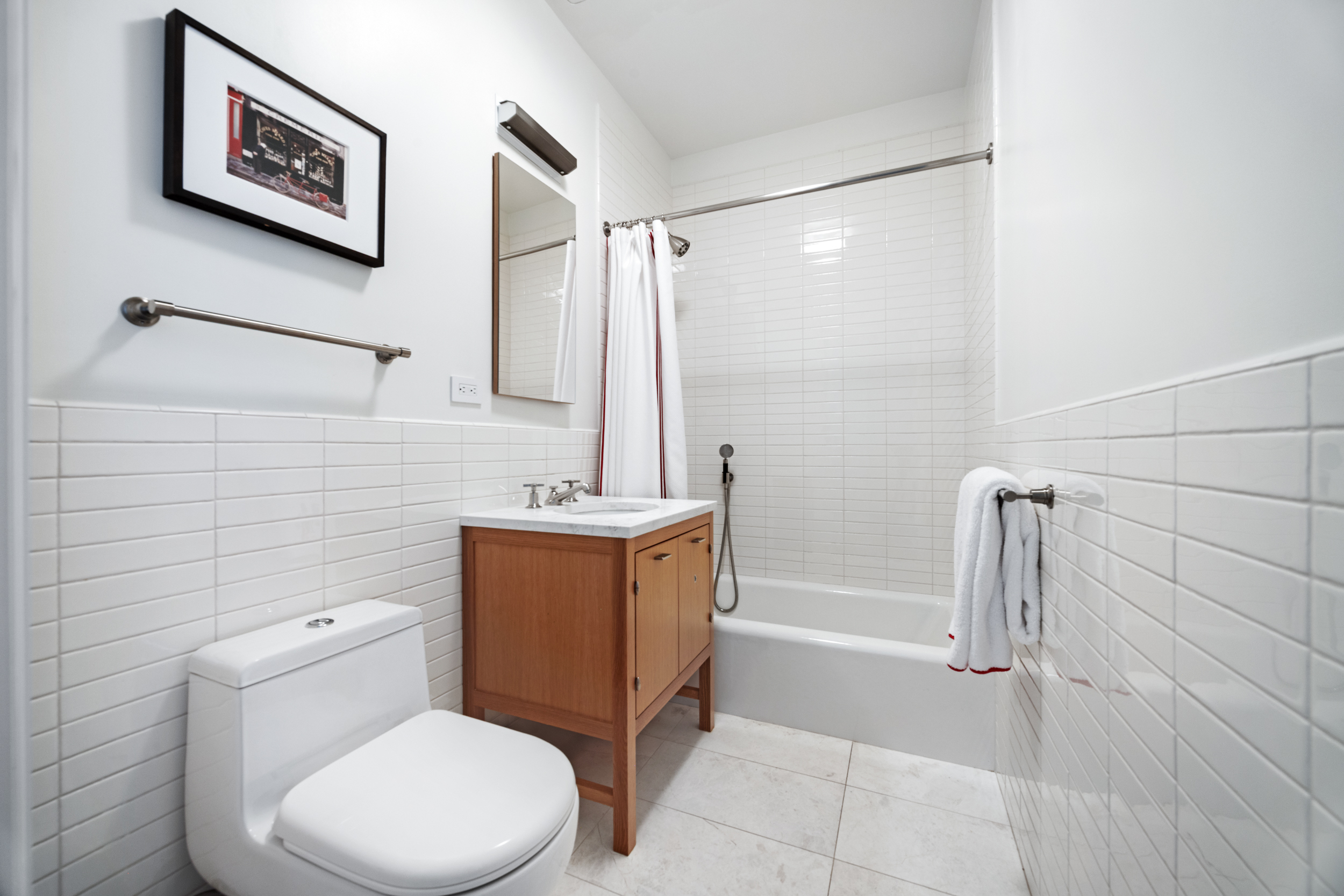 71 Laight Street, Unit 2F Manhattan, NY 10013 - Photo 13 of 20 a bathroom with a toilet a sink and shower