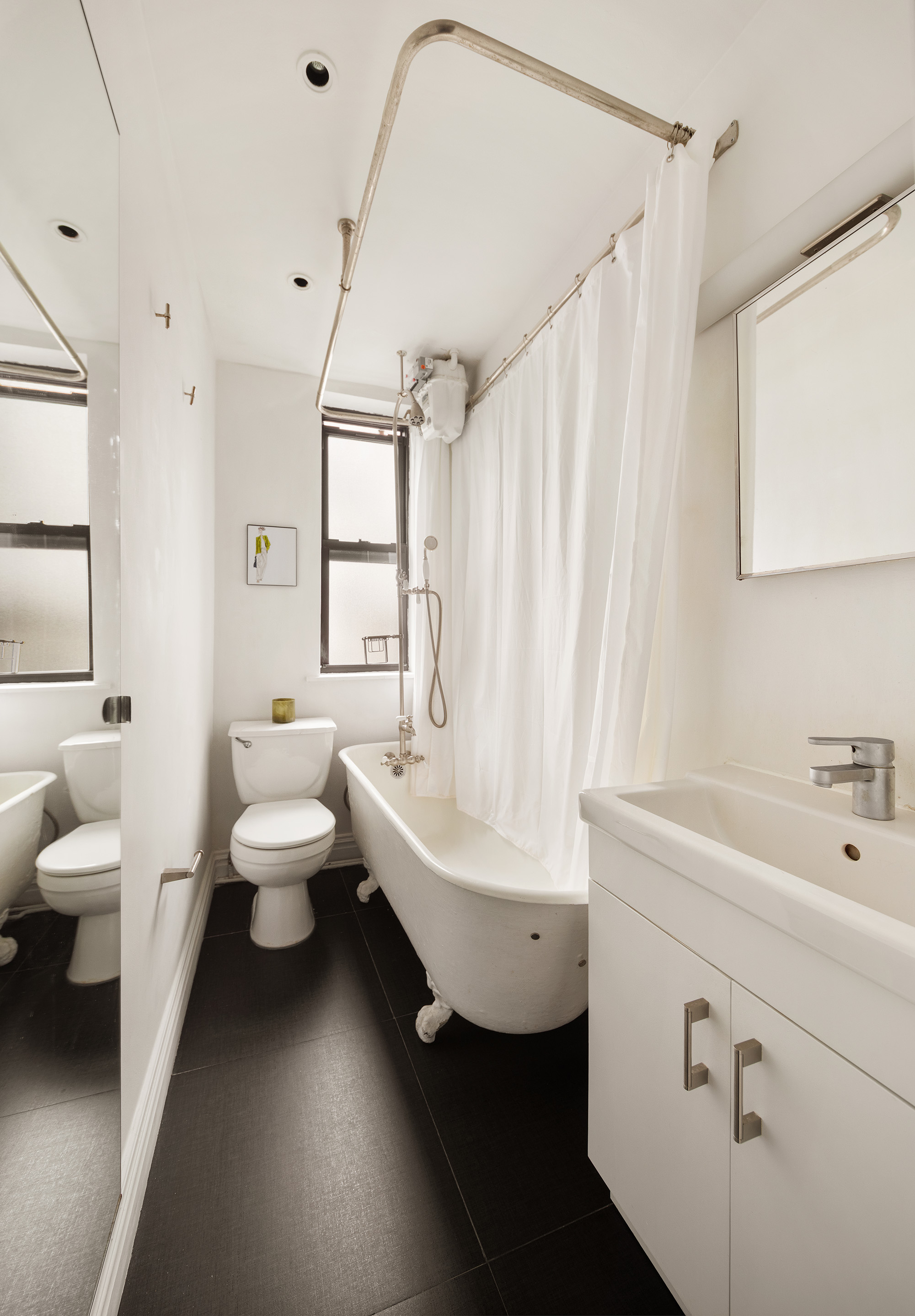 224 East 11th Street, Unit 19 Manhattan, NY 10003 - Photo 6 of 7 a bathroom with a sink toilet and shower