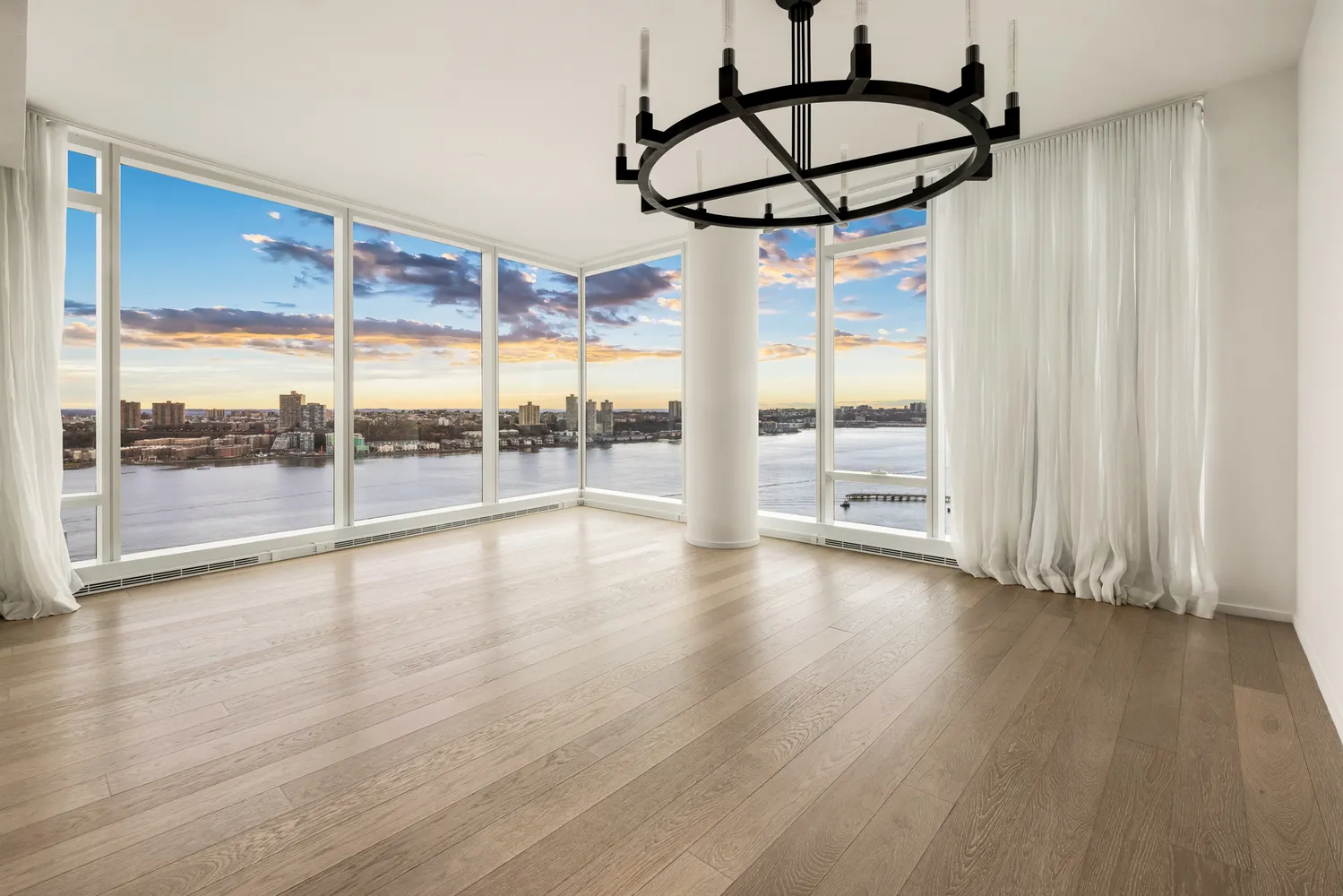 a view of room with window and wooden floor
