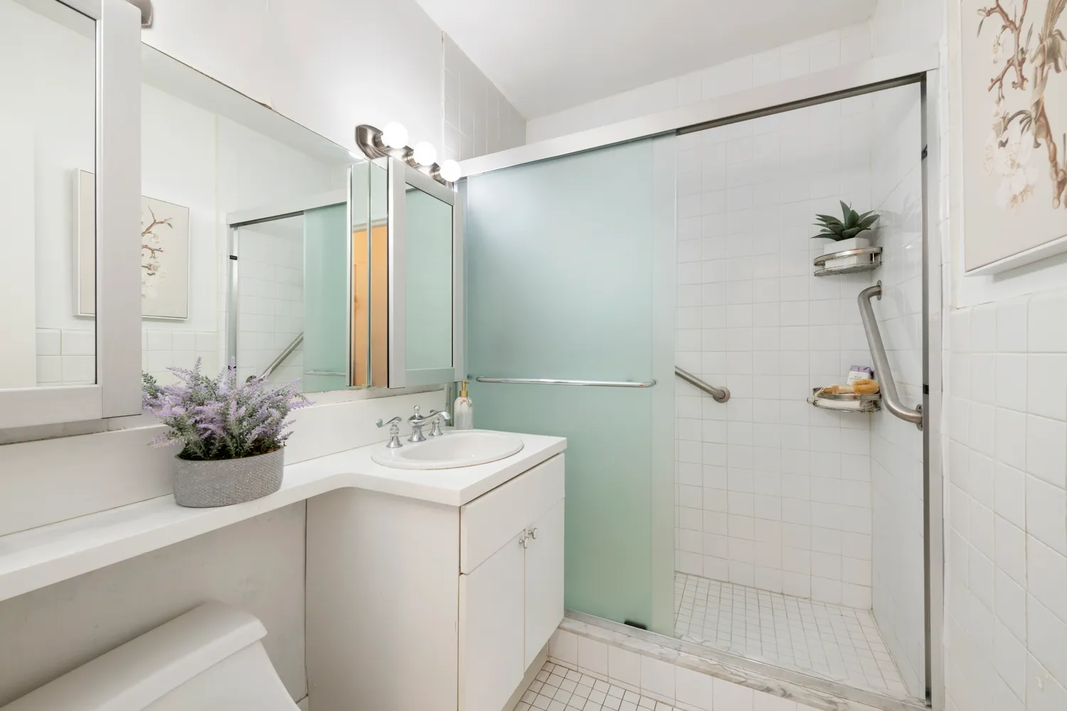 a bathroom with a sink and mirror