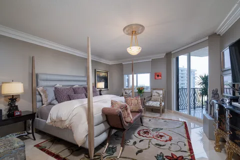 a bedroom with double bed and a lamp