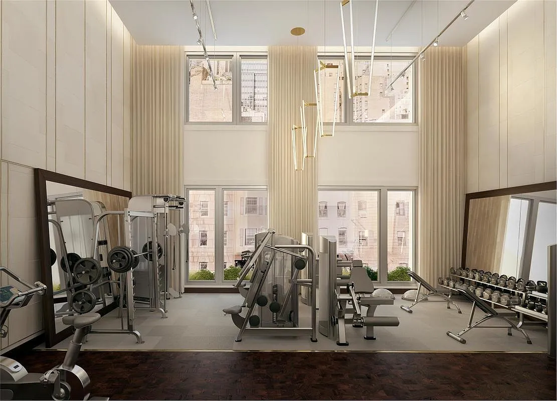301 East 50th Street, Unit 16B Manhattan, NY 10022 - Photo 13 of 15 a view of a room with gym equipment