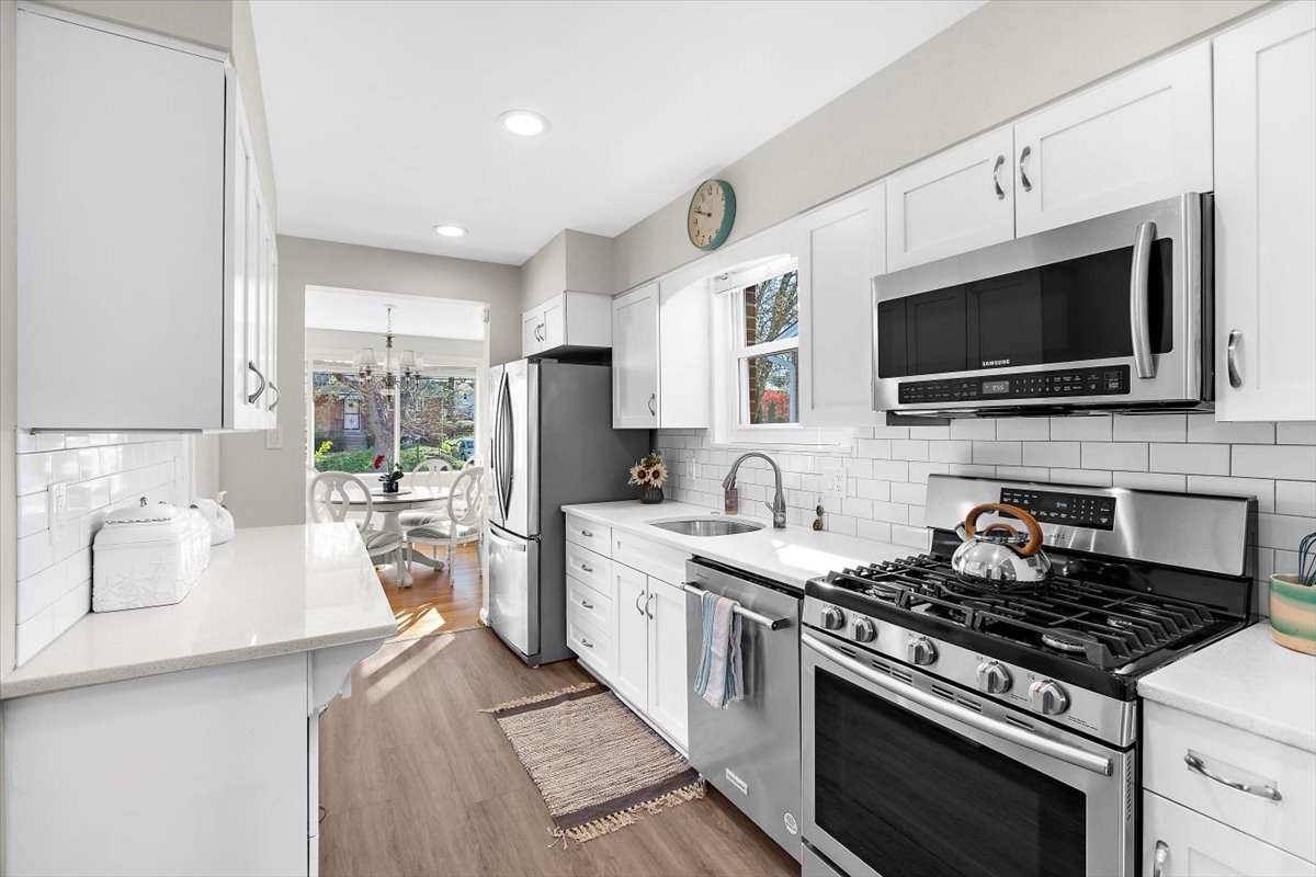 12712 Atherton Drive Silver Spring, MD 20906 - Photo 9 of 40 a kitchen with a stove a sink and a microwave