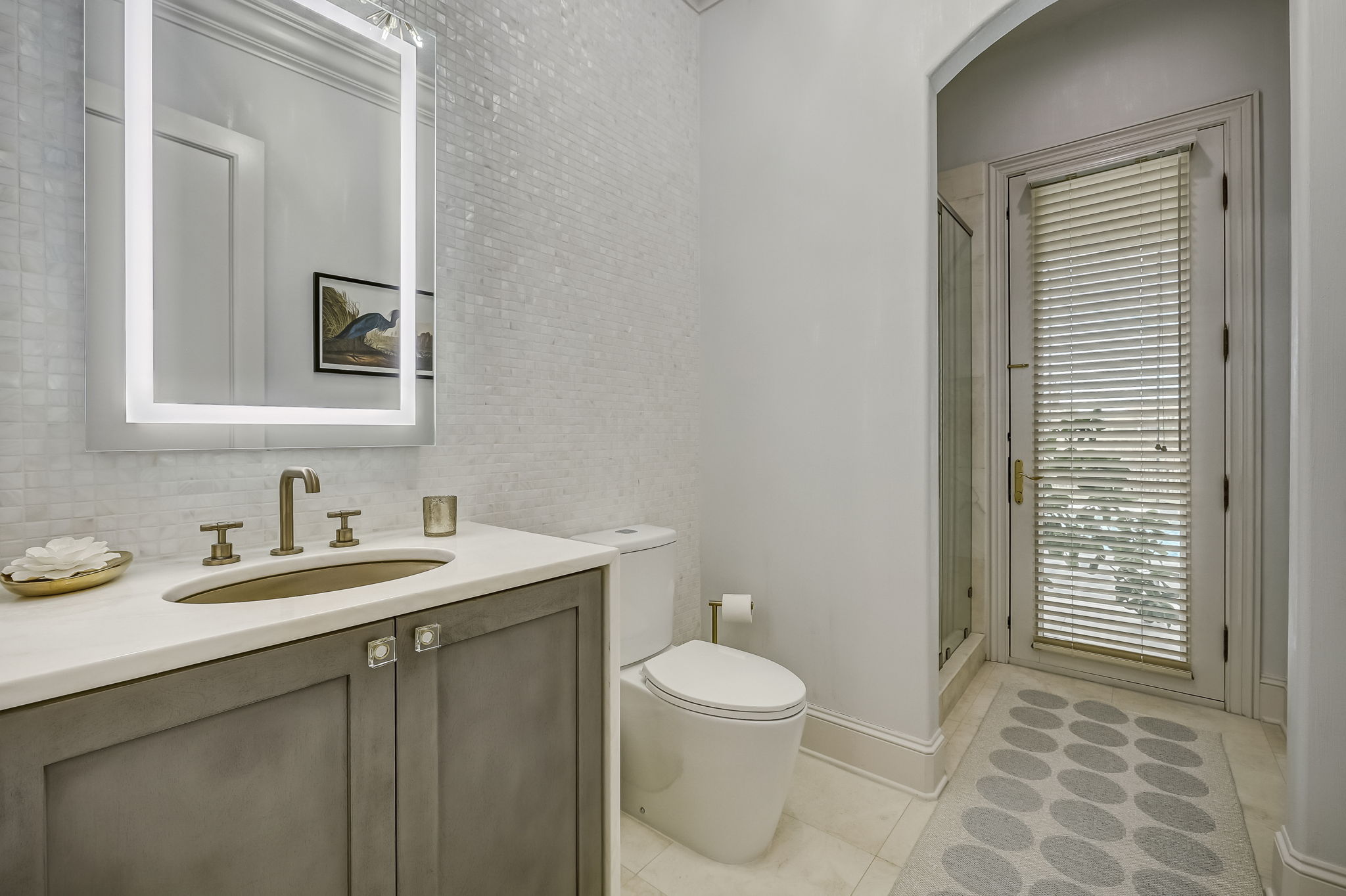24624 Harbour View Drive Ponte Vedra Beach, FL 32082 - Photo 63 of 186 a bathroom with a sink a toilet and a mirror
