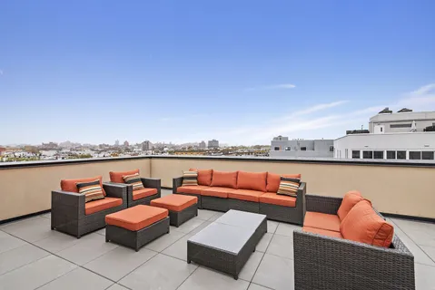 an outdoor sitting area with a couch