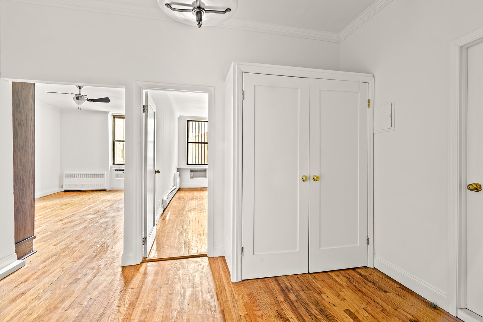 689 Fort Washington Avenue, Unit 1AA Manhattan, NY 10040 - Photo 6 of 13 a view of walk in closet with wooden floor