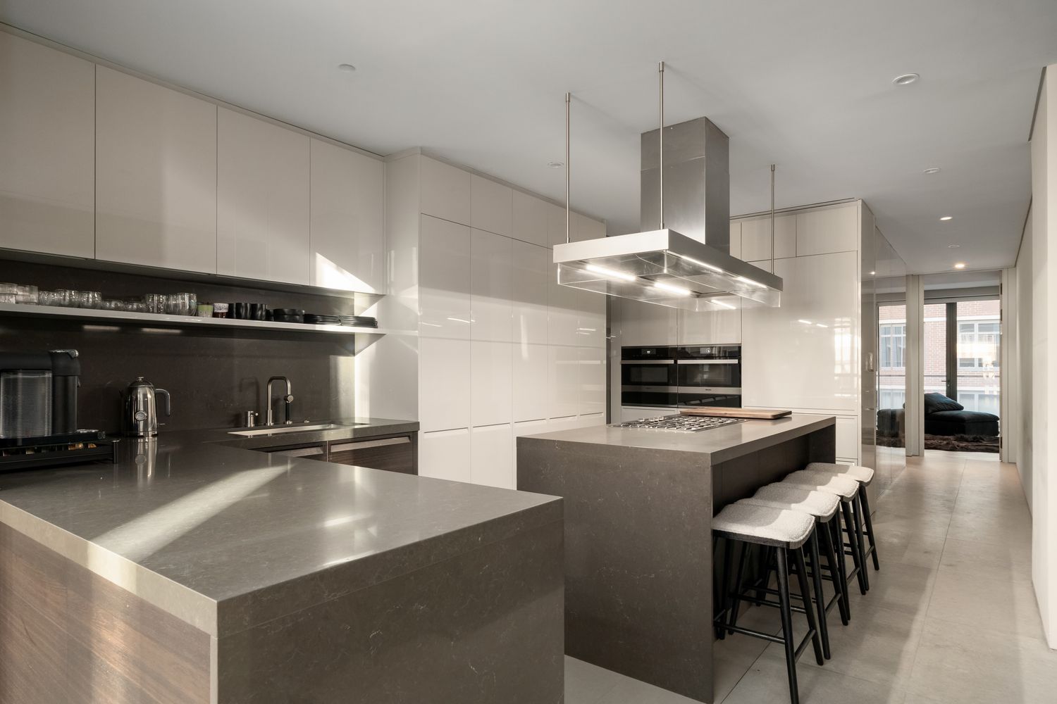 a kitchen with stainless steel appliances granite countertop a sink a stove and a refrigerator