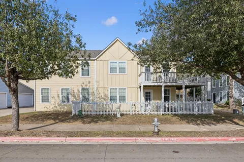a view of a house with a tree
