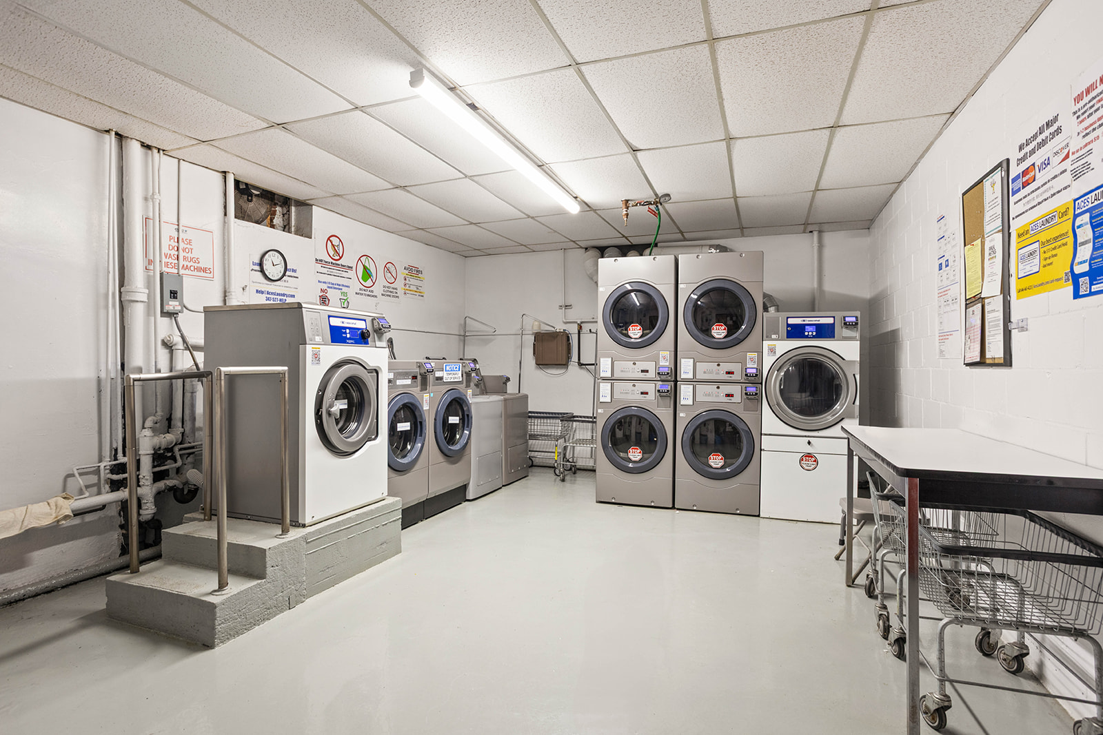 76-12 35th Avenue, Unit 6J Queens, NY 11372 - Photo 15 of 17 a utility room with dryer and washer