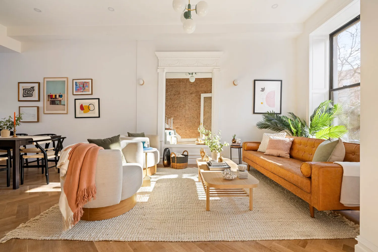 a living room with furniture potted plant and a window