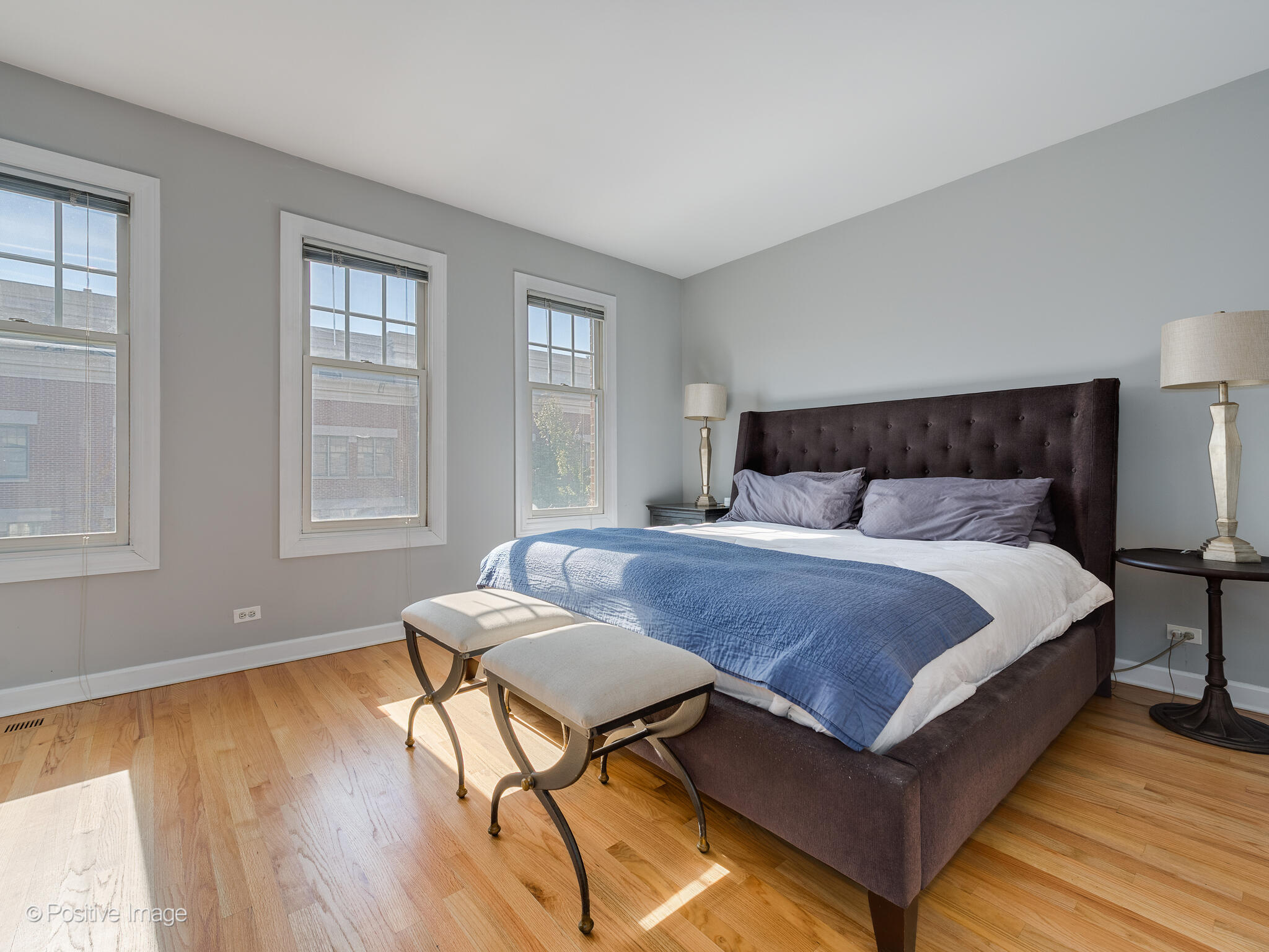 855 North May Street, Unit G Chicago, IL 60642 - Photo 20 of 28 a bedroom with a bed and wooden floor