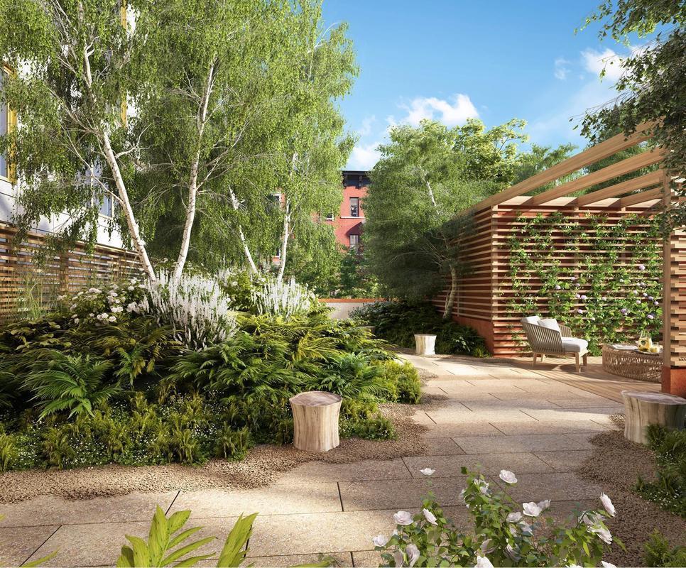 75 Kenmare Street, Unit 3B Manhattan, NY 10012 - Photo 5 of 8 a front view of a house with a yard