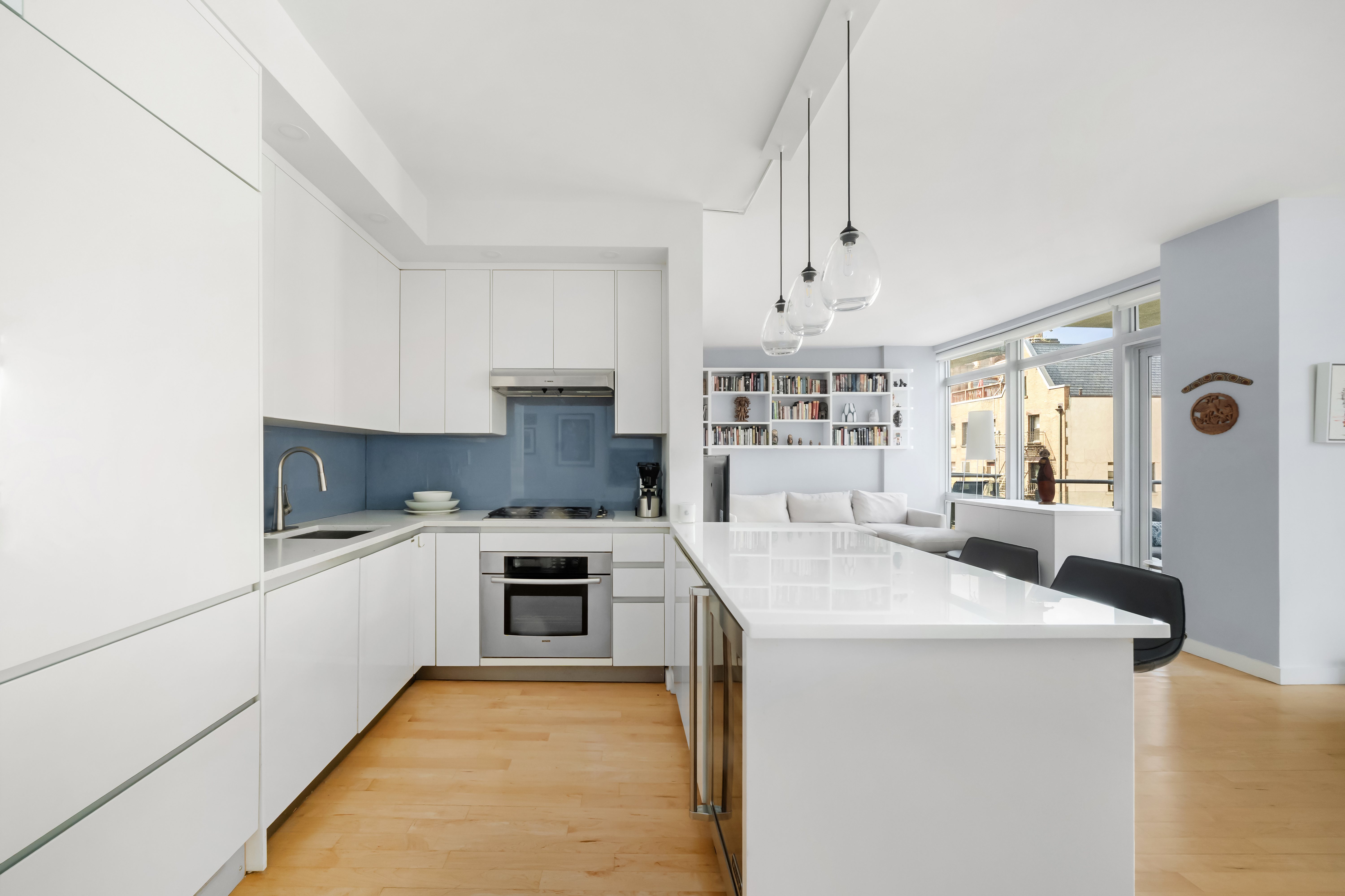 425 East 13th Street, Unit 4C Manhattan, NY 10009 - Photo 4 of 14 a kitchen with granite countertop a sink stove and refrigerator