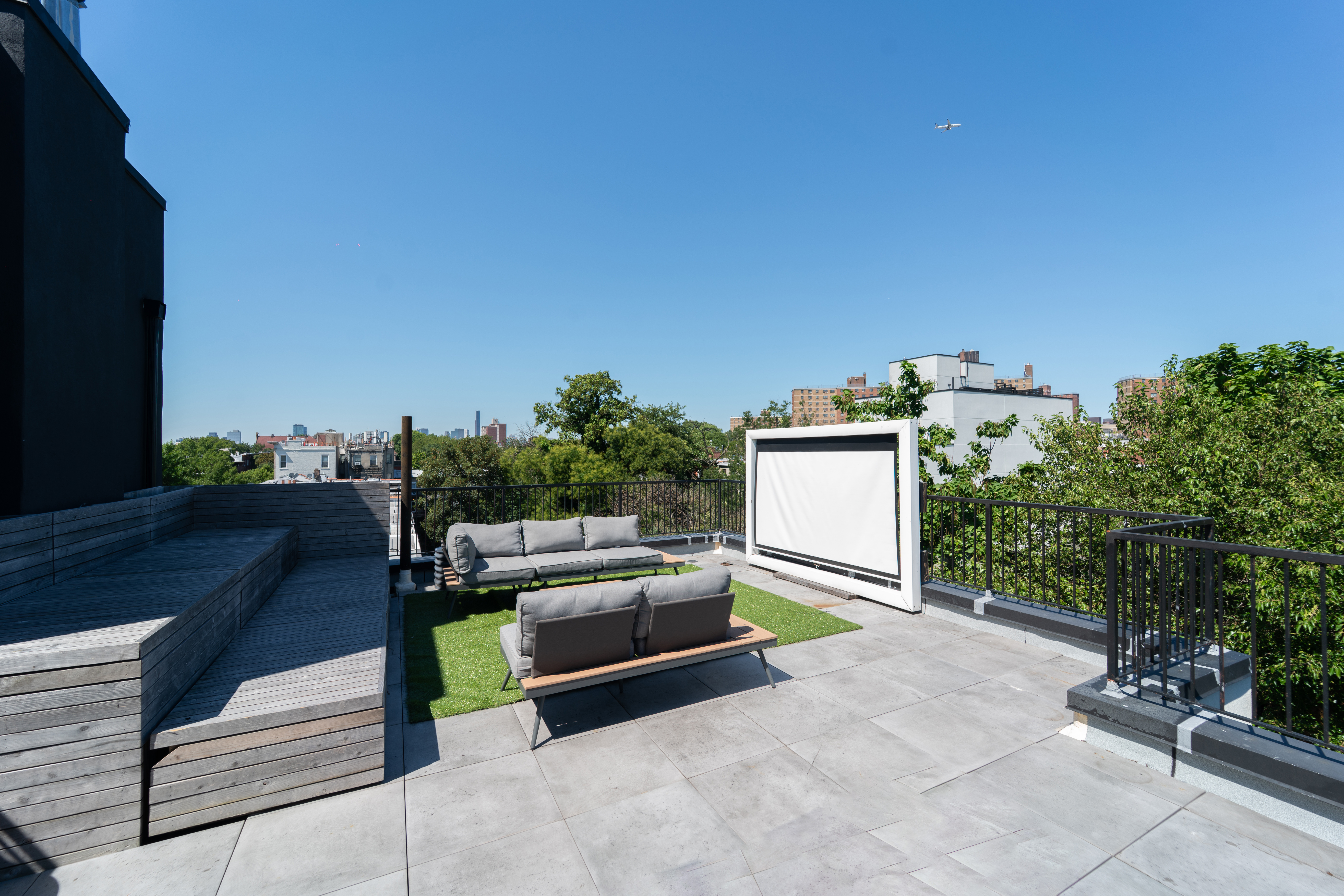 299 Van Buren Street, Unit 4C Brooklyn, NY 11221 - Photo 2 of 16 a view of a terrace with couches and potted plants