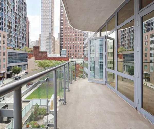 a view of balcony with furniture