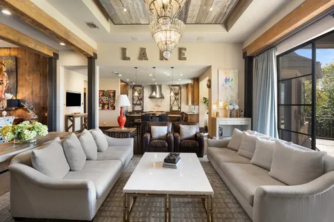 a view of a chair and tables in the balcony