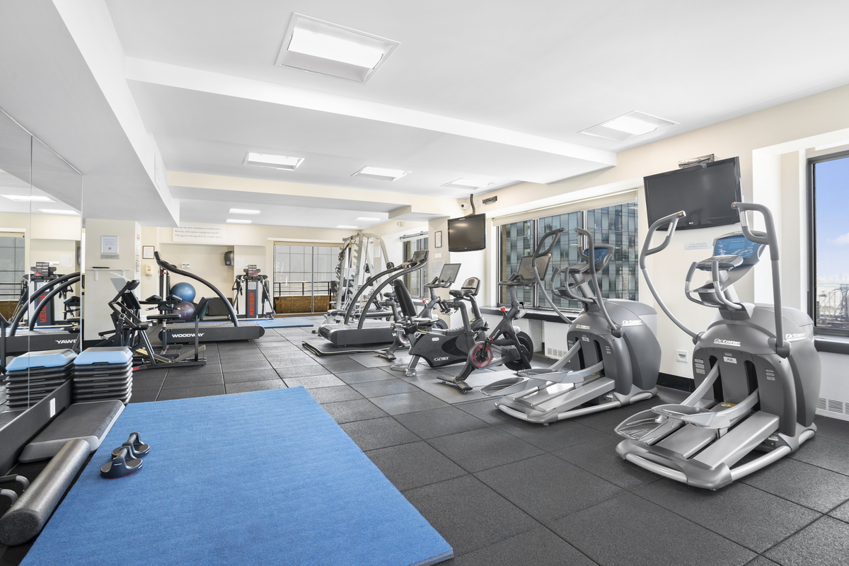 400 East 70th Street, Unit 807 Manhattan, NY 10021 - Photo 8 of 9 a view of a room with gym equipment