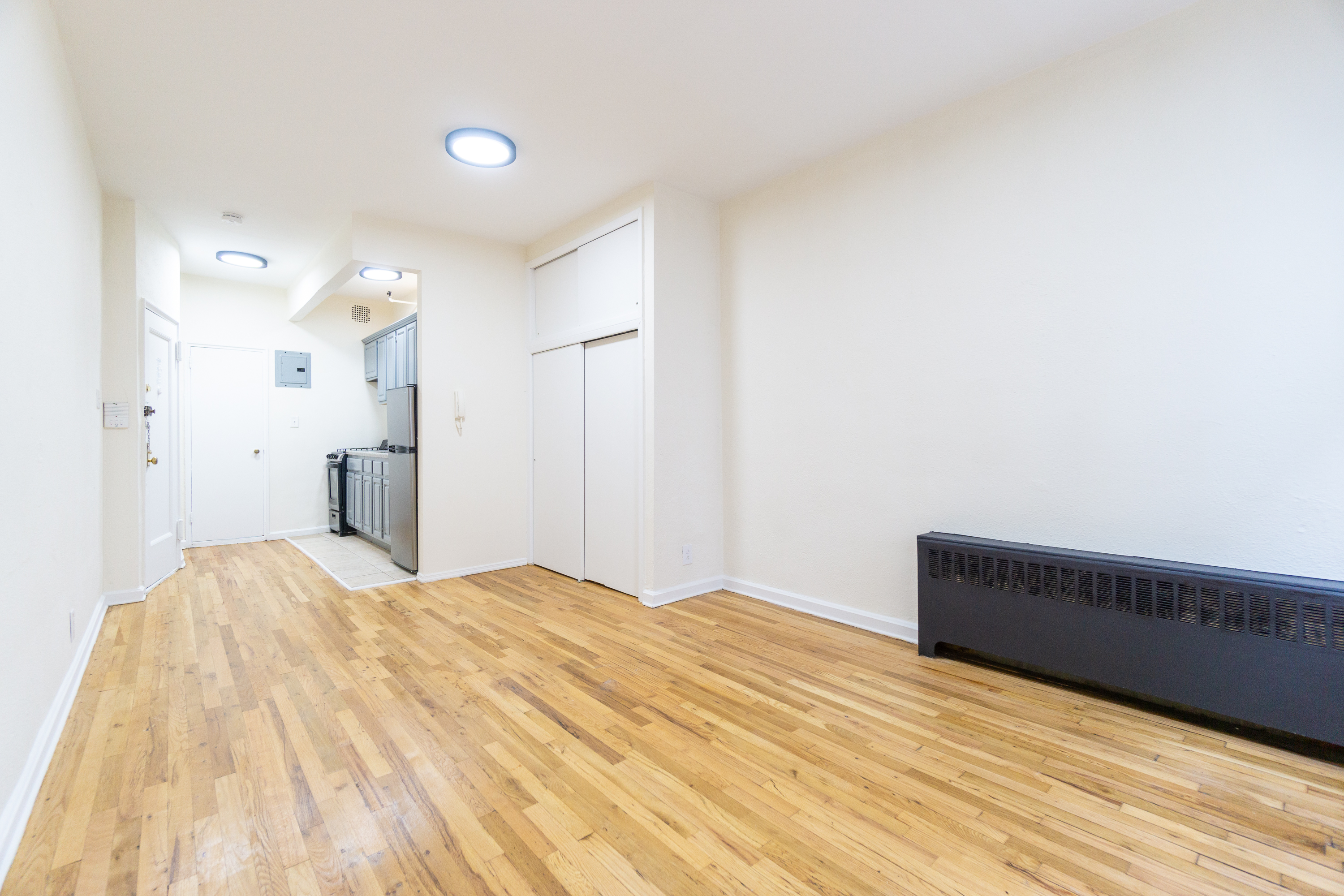 319 East 25th Street, Unit 5C Manhattan, NY 10010 - Photo 4 of 14 a large white bed in a white room
