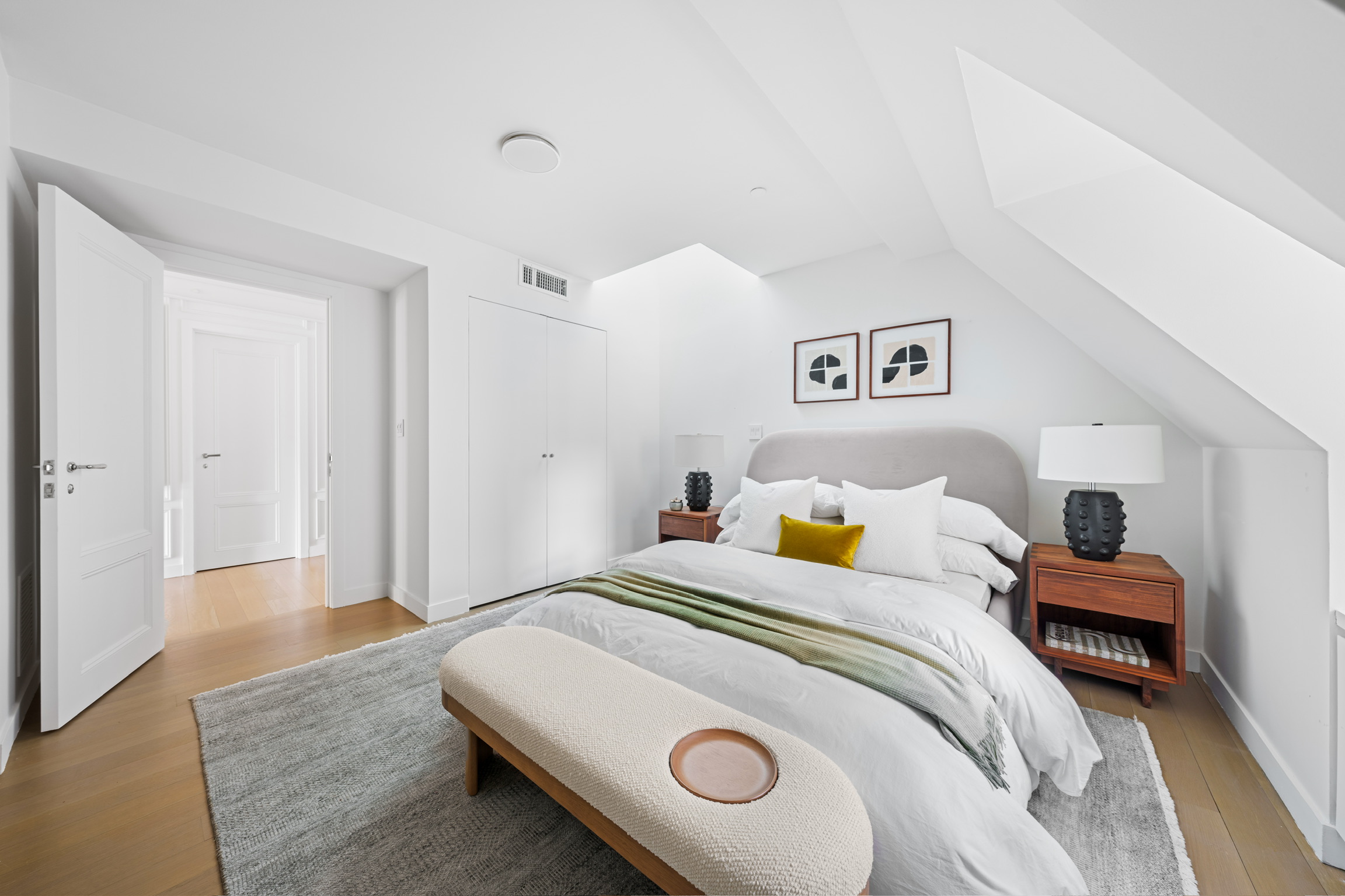 1200 Broadway, Unit PH89 Manhattan, NY 10001 - Photo 27 of 47 a bedroom with a bed and a chandelier