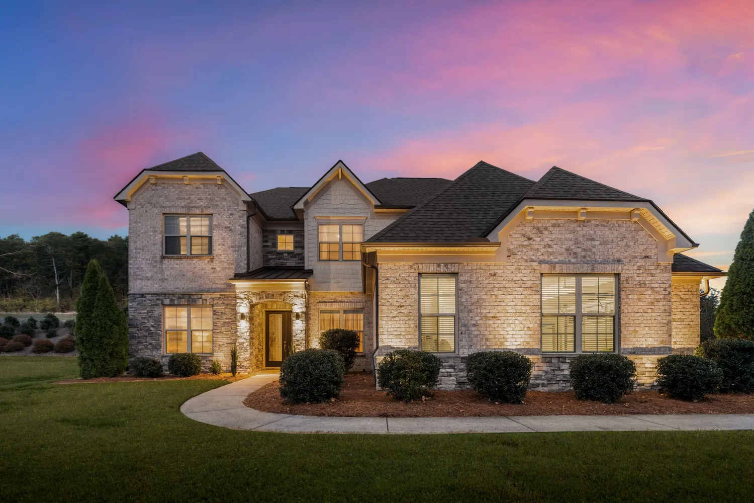 a front view of a house with a yard