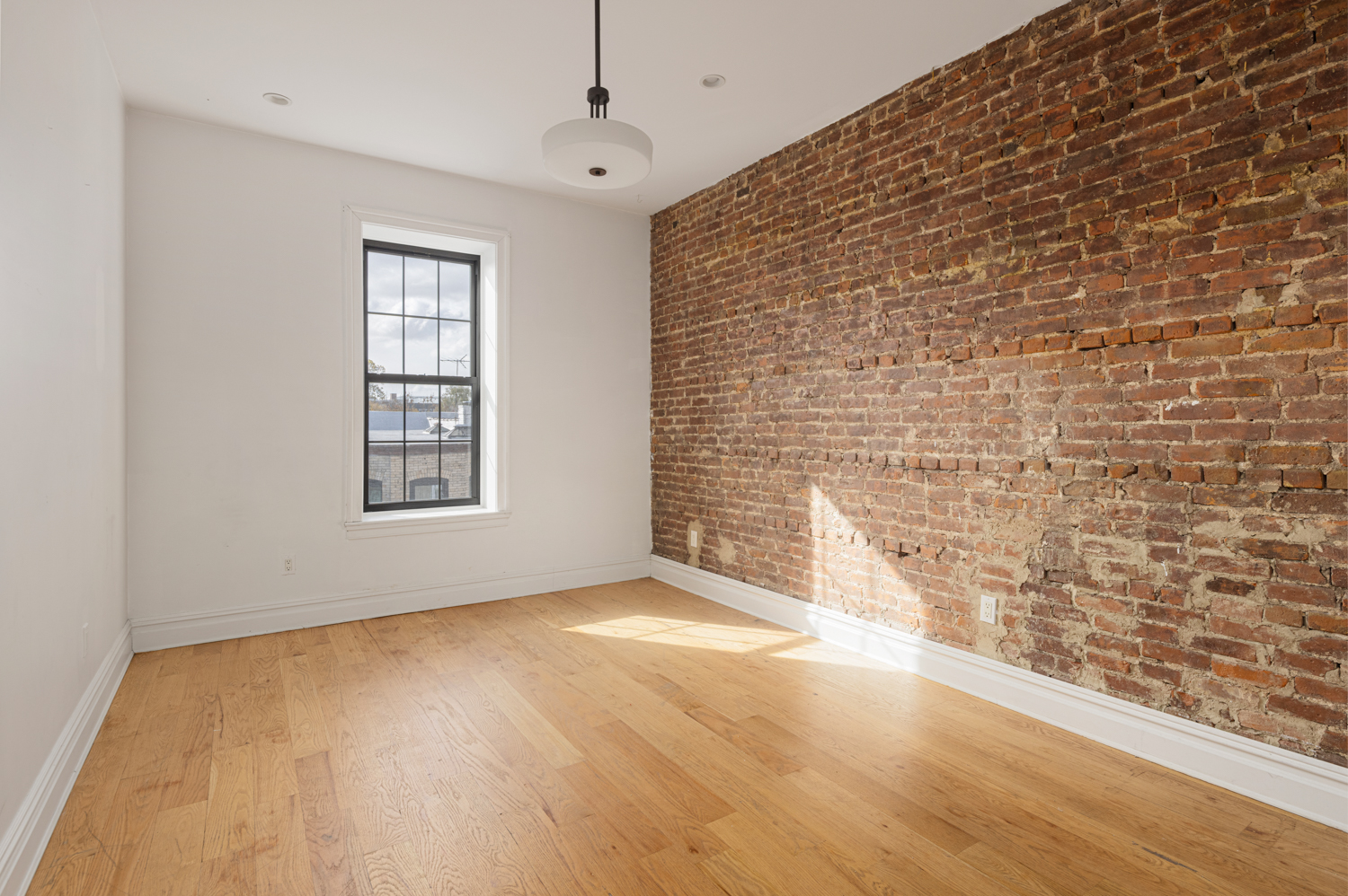 912 Eastern Parkway, Unit 1 Brooklyn, NY 11213 - Photo 9 of 11 a view of an empty room with a window