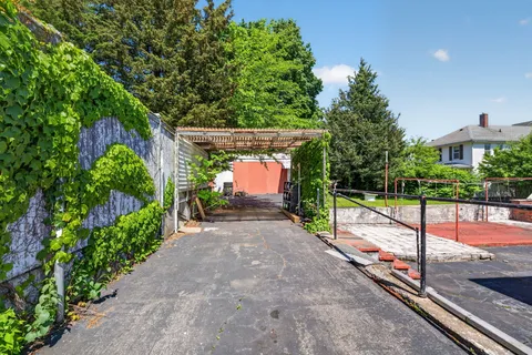 a view of a park with potted plants