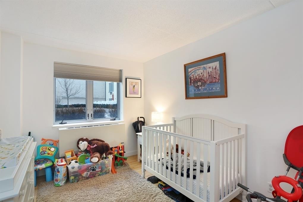 53 Boerum Place, Unit 2J Brooklyn, NY 11201 - Photo 4 of 9 a bedroom with furniture and a window