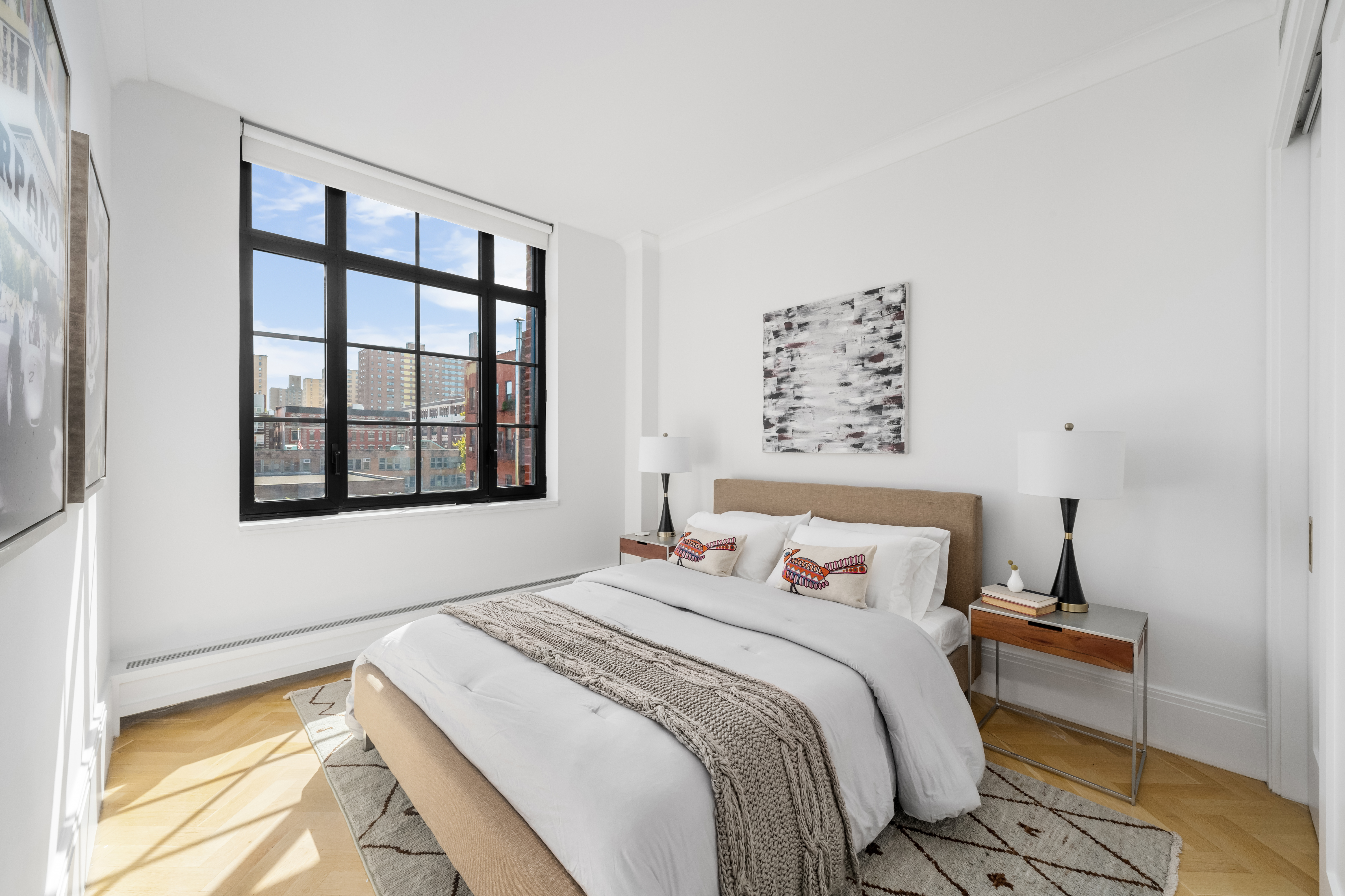 50 Clinton Street, Unit 4A Manhattan, NY 10002 - Photo 6 of 12 a bedroom with a bed and a window