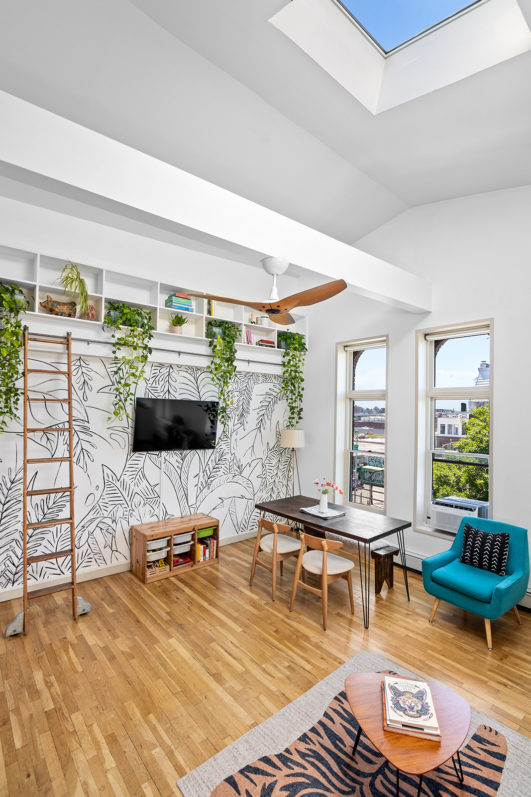 57 3rd Street, Unit 7 Brooklyn, NY 11231 - Photo 2 of 13 a living room with furniture and a flat screen tv