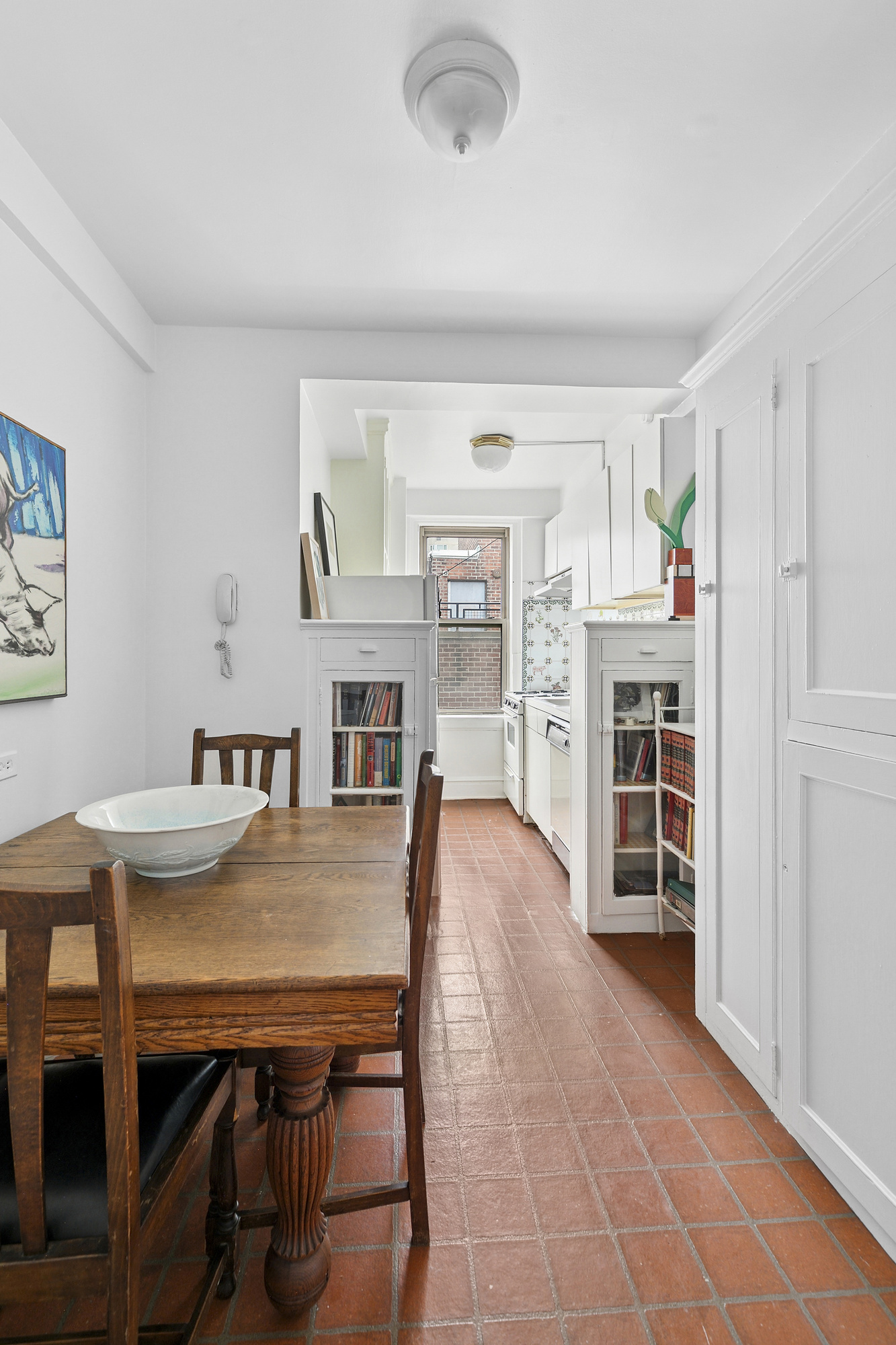333 East 53rd Street, Unit 12L Manhattan, NY 10022 - Photo 4 of 9 a dining room with furniture and wooden floor