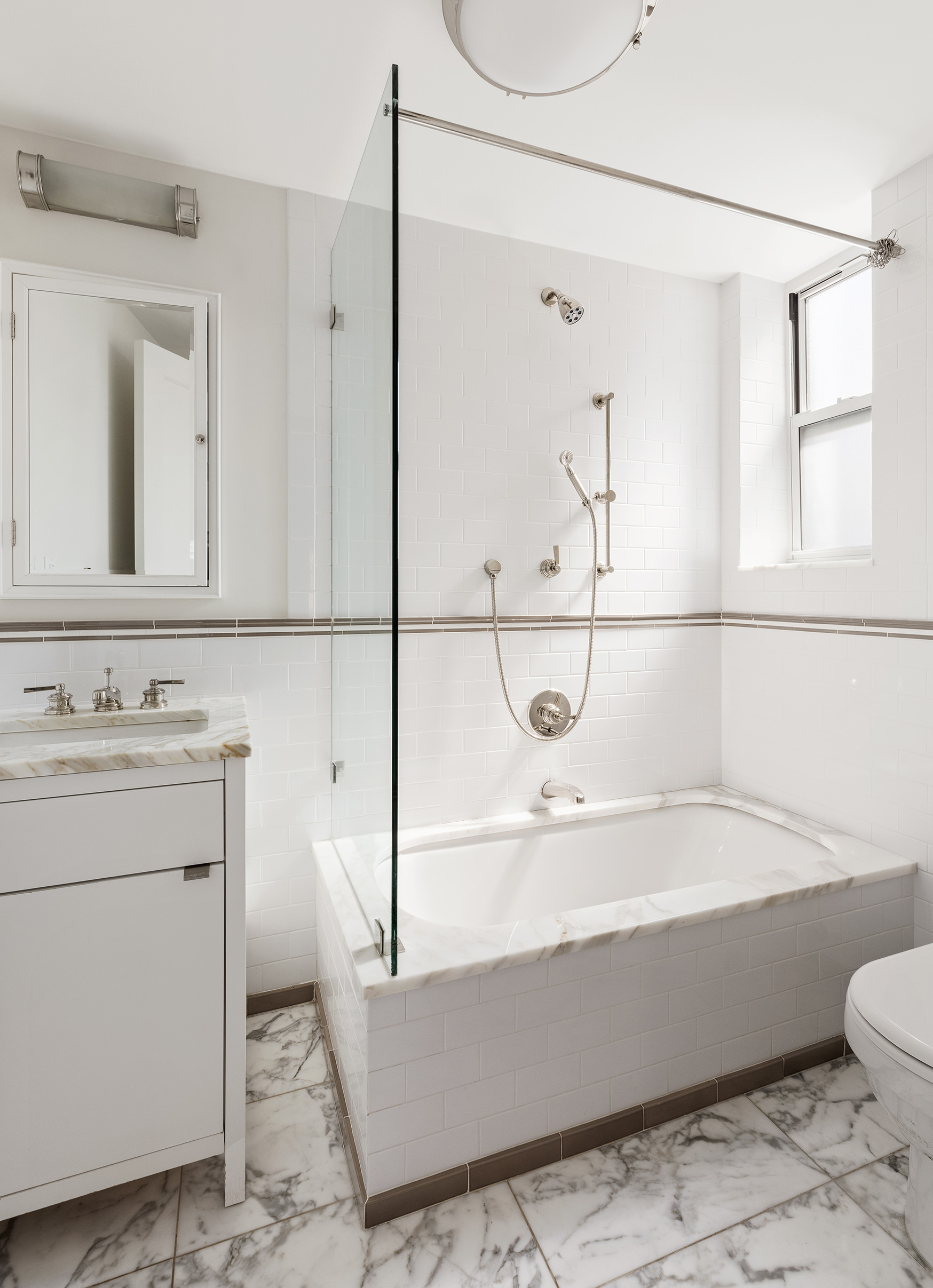 165 West 91st Street, Unit 9AB Manhattan, NY 10024 - Photo 14 of 24 a bathroom with a sink a toilet and shower
