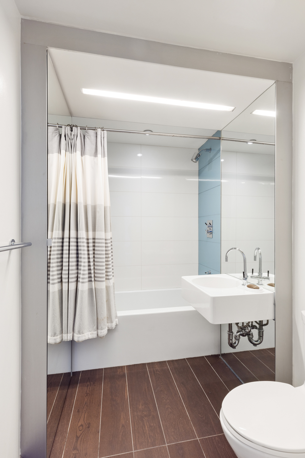 2 Northside Piers, Unit 25P Brooklyn, NY 11249 - Photo 17 of 26 a bathroom with a sink toilet and shower