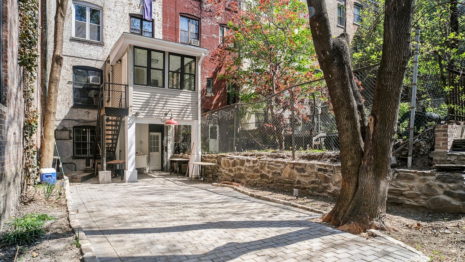 614 West 146th Street, Unit 4FAM Manhattan, NY 10031 - Photo 16 of 18 a view of a building with trees