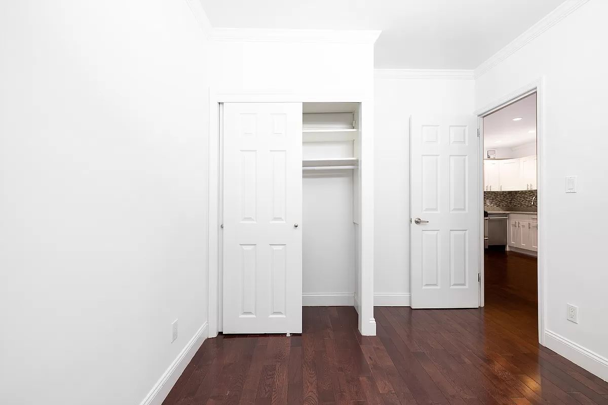 328 West 19th Street, Unit 1B Manhattan, NY 10011 - Photo 6 of 11 a view of empty room with wooden floor