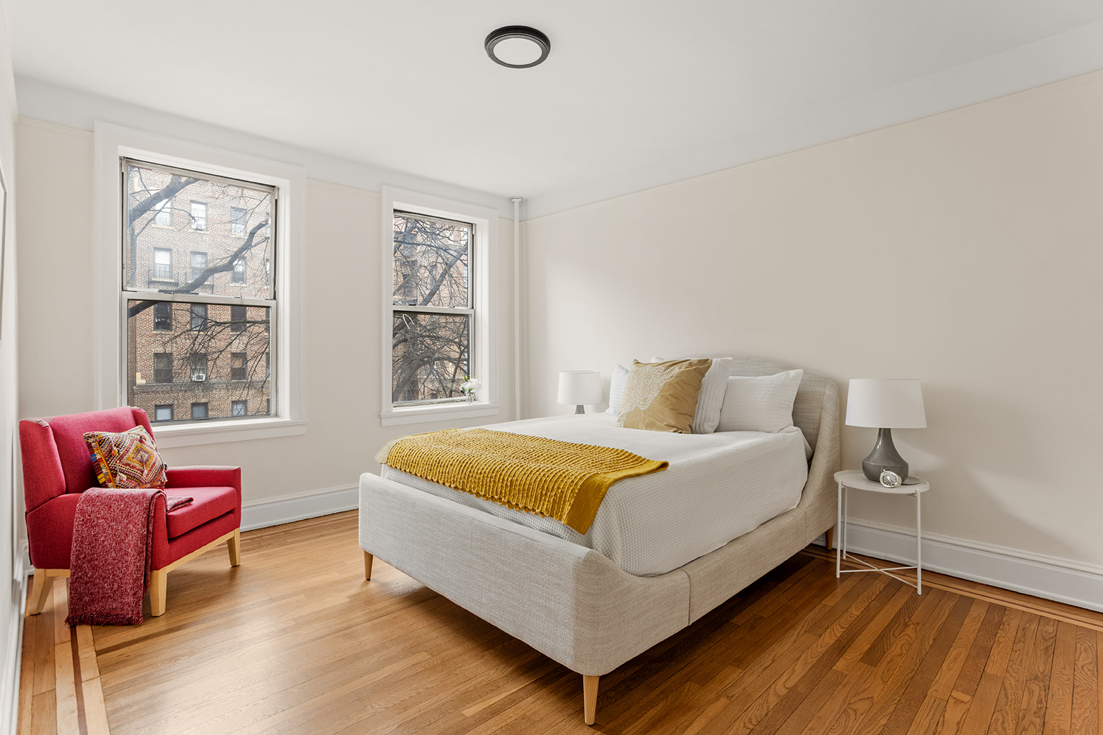 37-16 80th Street, Unit 32 Queens, NY 11372 - Photo 5 of 13 a bedroom with a bed and wooden floor