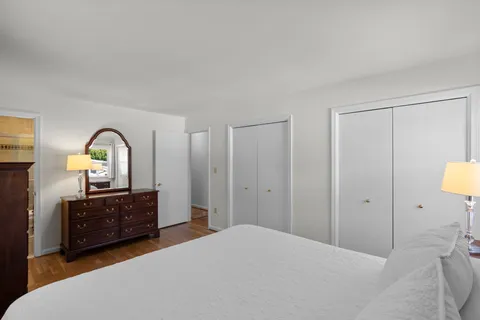 a bed room with a bed and a dresser