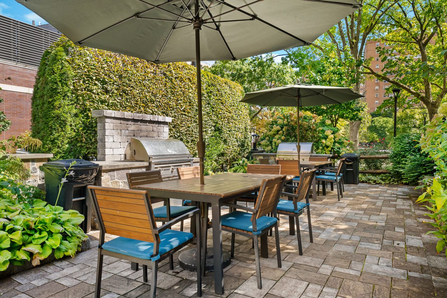 a view of an outdoor sitting area with chairs and umbrella