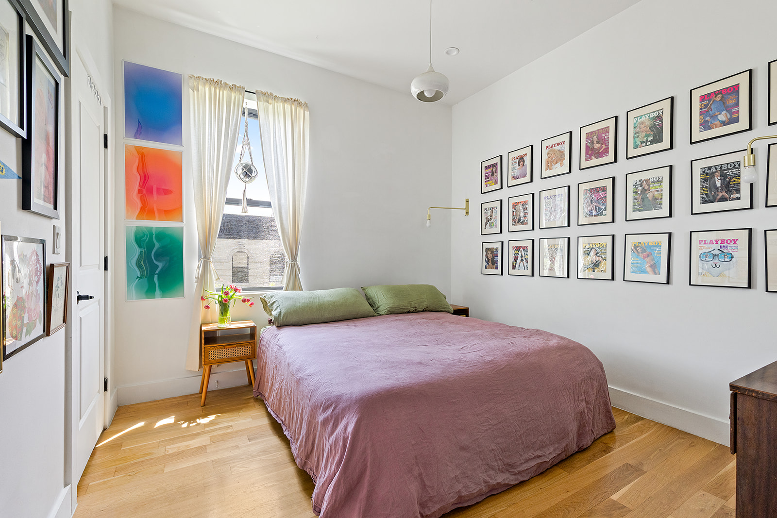 1474 Bushwick Avenue, Unit 4R Brooklyn, NY 11207 - Photo 3 of 8 a bedroom with a bed next to a window with the outer view