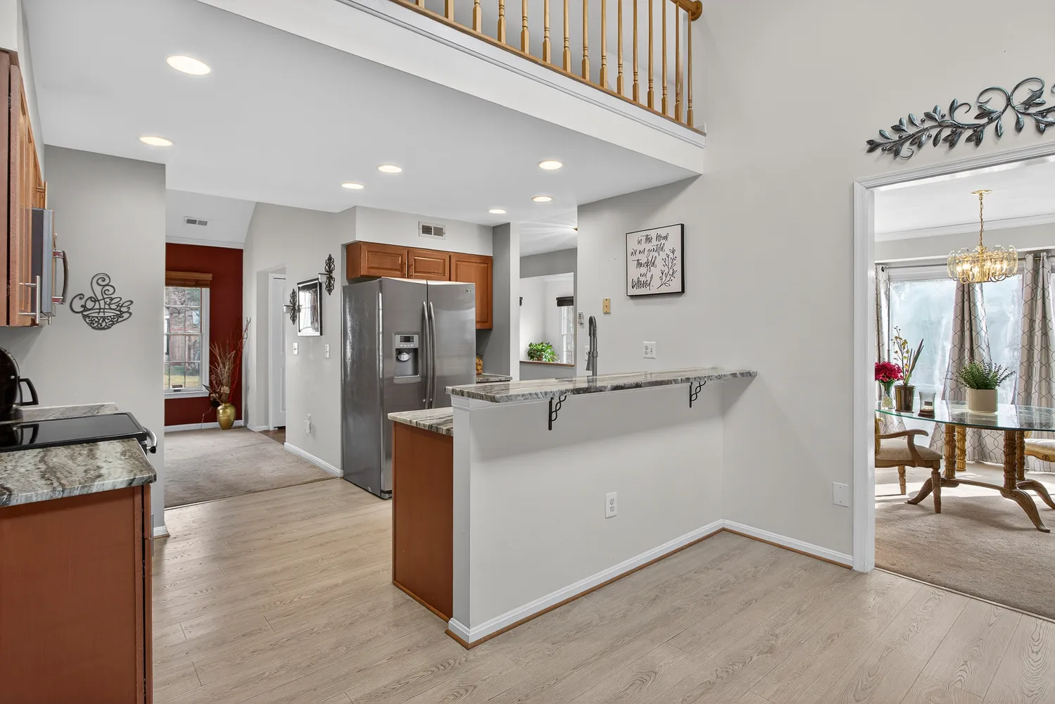 a view of a living room kitchen and a sink