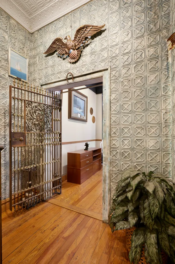 a view of a door and wooden floor