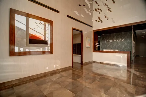 a view of an empty room with a fireplace