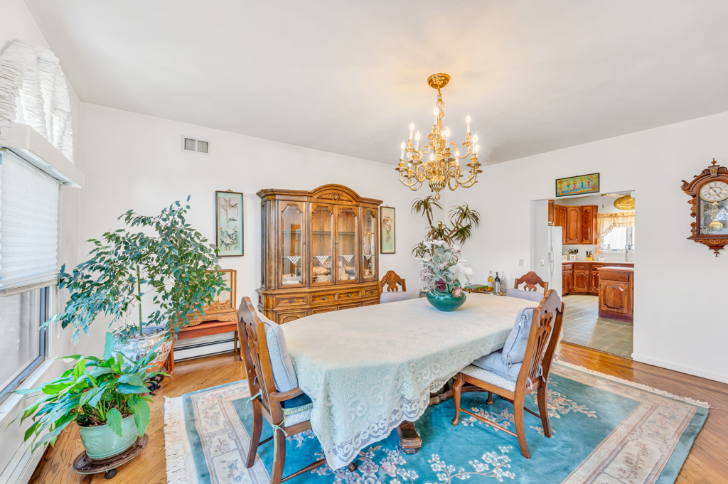 35 Poe Street Staten Island, NY 10307 - Photo 11 of 36 a view of a dining room with furniture wooden floor and chandelier