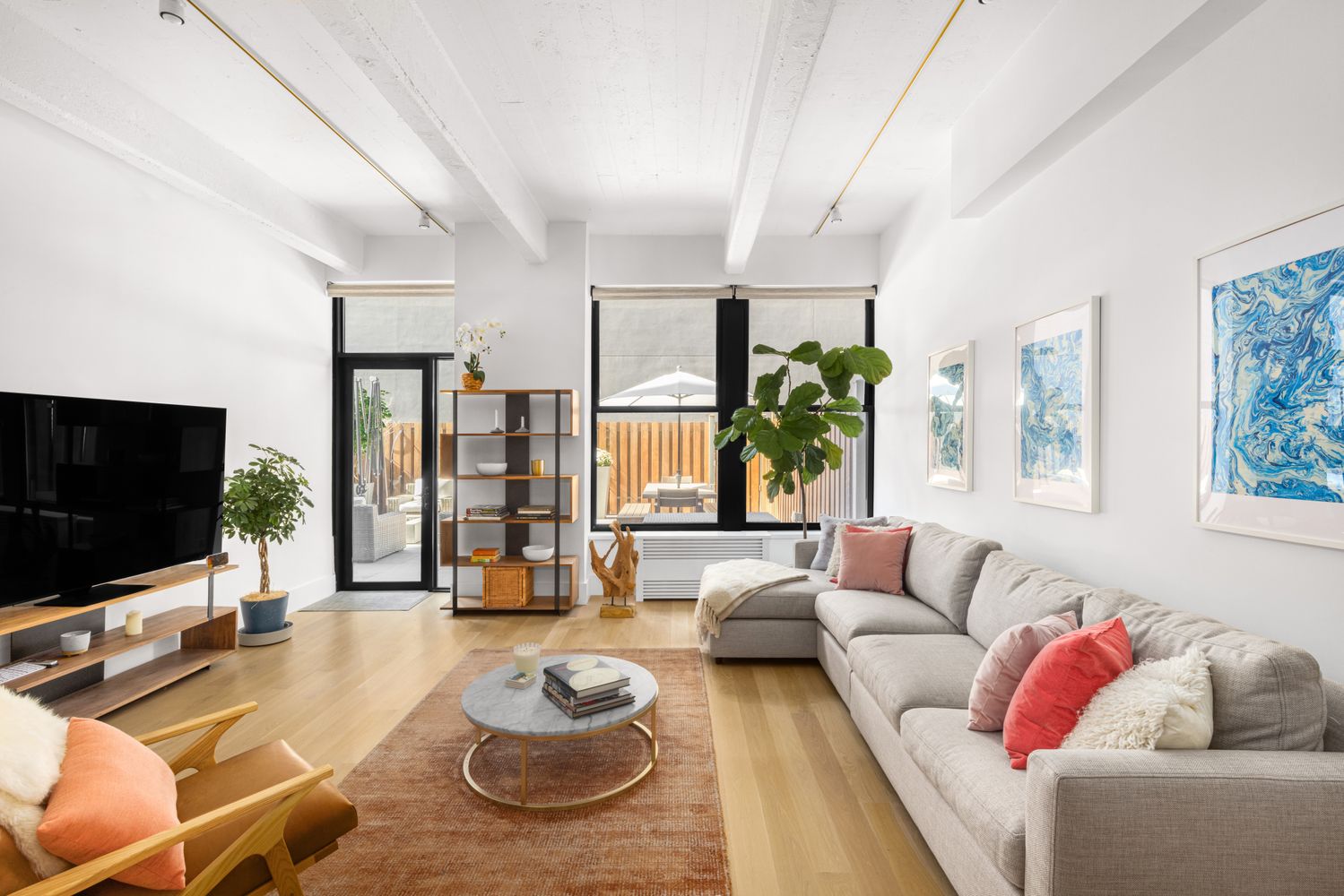 a living room with furniture and a flat screen tv