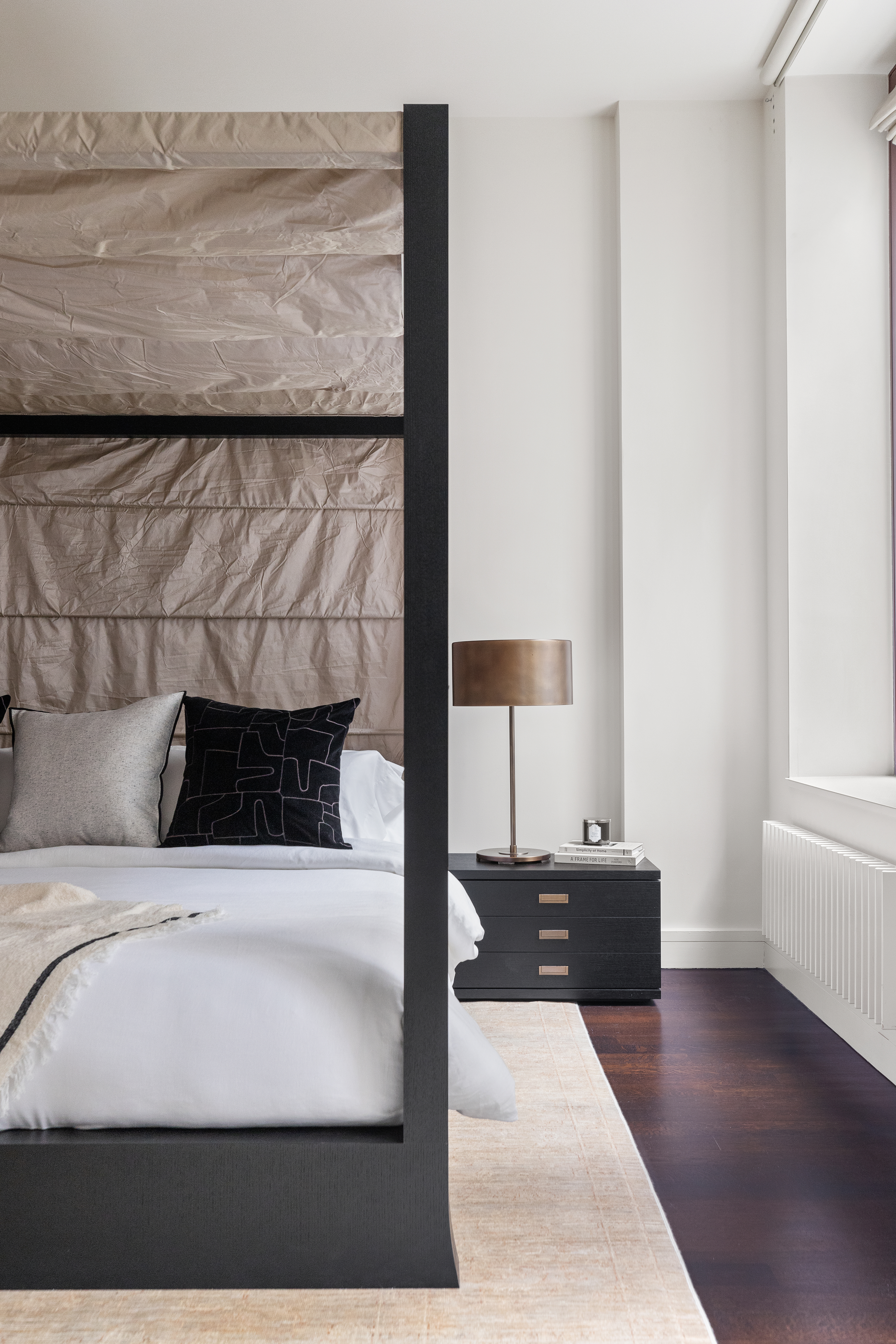 388 West Broadway, Unit 2 Manhattan, NY 10012 - Photo 14 of 27 a bedroom with a bed and a night stand