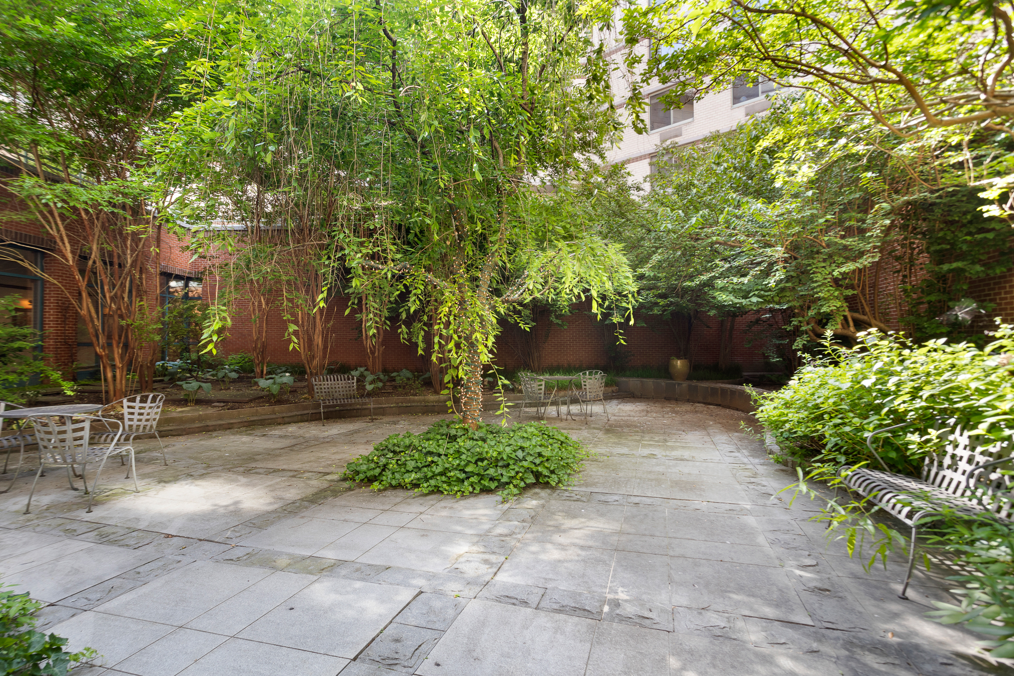 21 South End Avenue, Unit 406 Manhattan, NY 10280 - Photo 13 of 16 a view of a yard with plants and trees