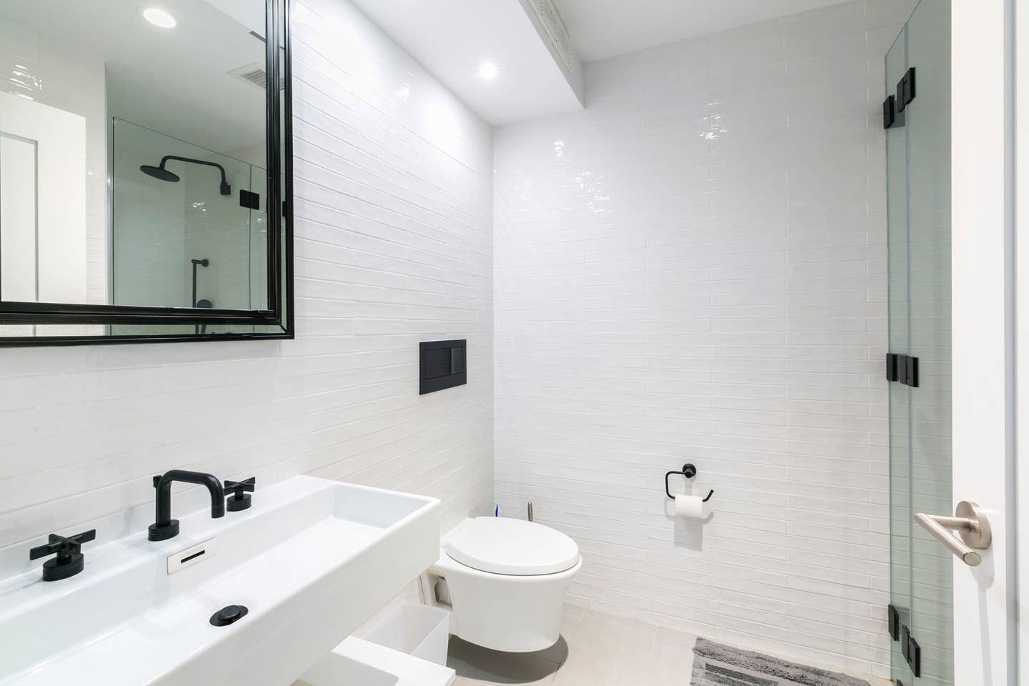 265 East Houston Street, Unit 4 Manhattan, NY 10002 - Photo 16 of 20 a bathroom with a sink and a mirror