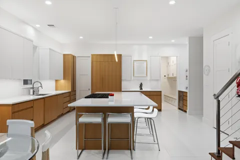 a dining room with furniture a fireplace and a flat screen tv